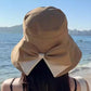 👒☀️Széles karimájú, masnis napvédő kalap nőknek